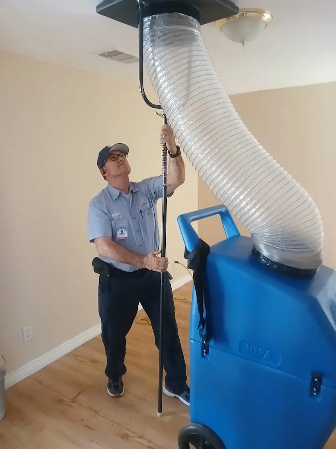 Furnace Tune-Up technician using HEPA equipment in Silver Spring